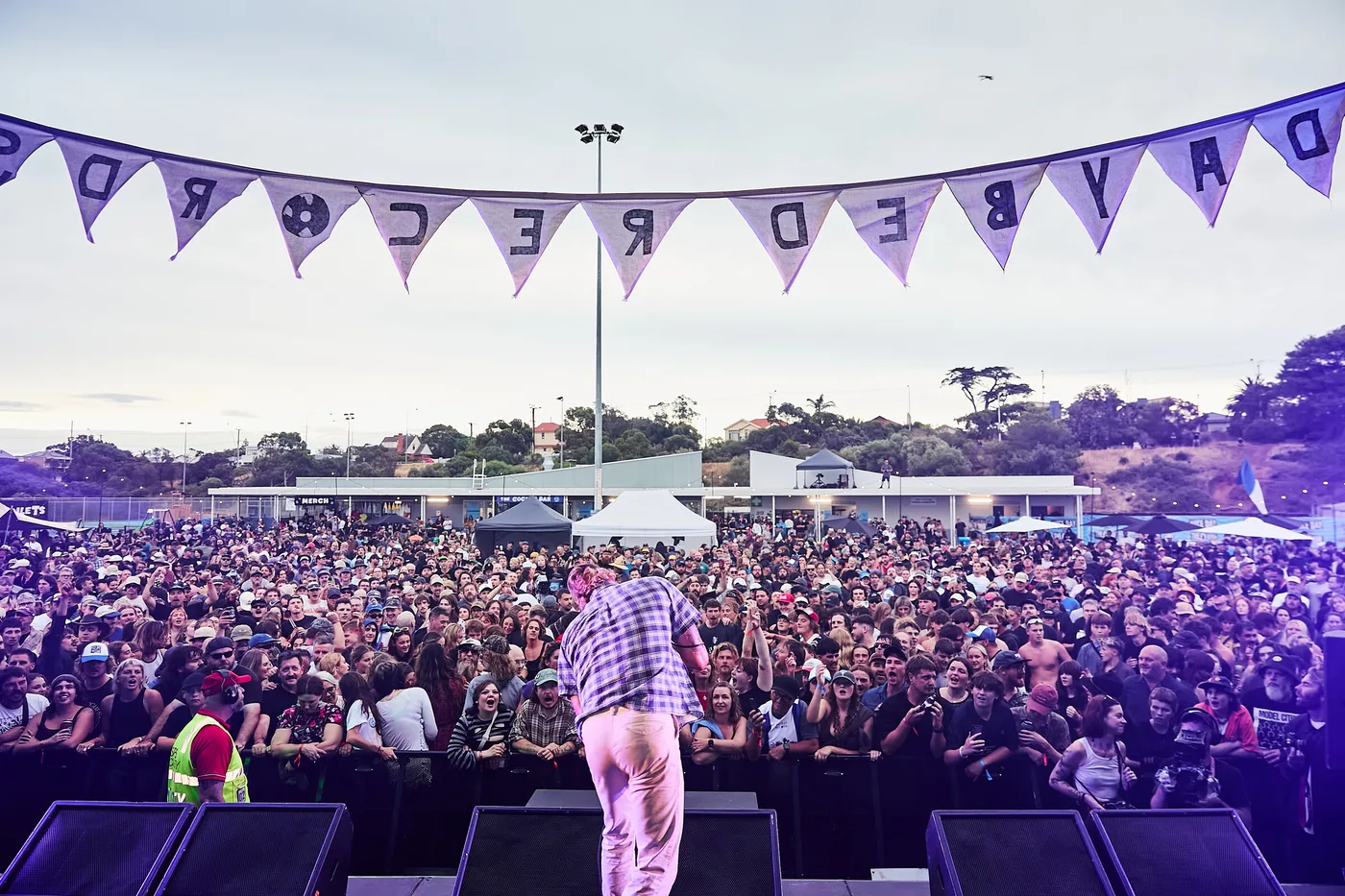 Mini Skirt playing to a packed oval, seen from the stage under the Daybed Records bunting